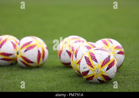 Soccer ball lying on the ground Stock Photo