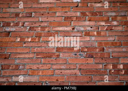 background of an old pink and orange brick wall Stock Photo