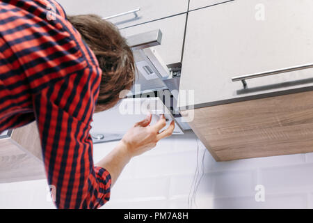 Stove Exhaust Fan Extractor Filter Maintenance And Change Stock Photo -  Alamy