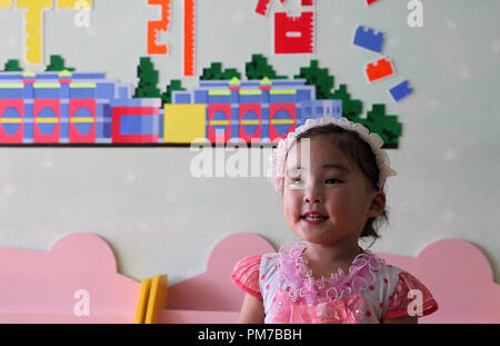 Little girl at Nampo Orphanage in North Korea Stock Photo