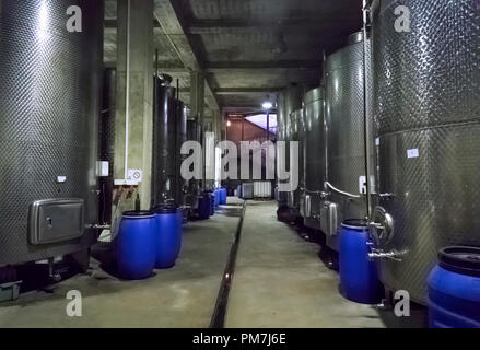 Steel barrels for fermentation of wine in winemaker factory Stock Photo