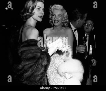Studio Publicity Still: Lauren Bacall and Marilyn Monroe at the premiere of 'How to Marry a Millionaire'  circa 1953  File Reference # 31386 1182THA Stock Photo