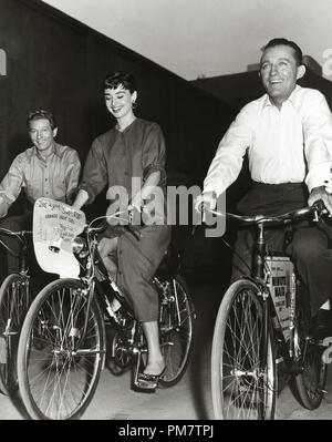 Audrey Hepburn, Bing Crosby and Danny Kaye riding their Bicycles on the Paramount lot, circa 1954.  File Reference # 31386 766THA Stock Photo
