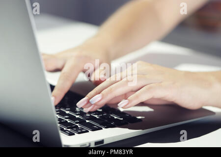 Businesswoman typing on laptop at workplace Woman working in home office hand keyboard Stock Photo