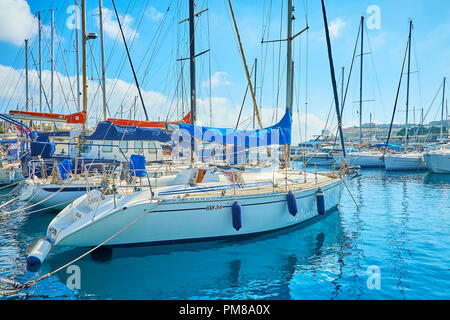 VALLETTA, MALTA - JUNE 17, 2018: The dense rows of moored sailing yachts in marina, on June 17 in Valletta. Stock Photo