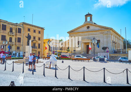 VALLETTA, MALTA - JUNE 17, 2018: The Malta Stock Exchange houses in building of Garrison Chapel, situated in Castille Place, one of the most beautiful Stock Photo