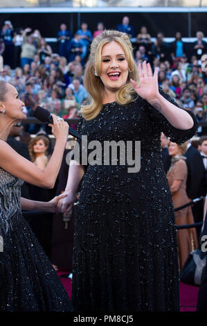 Kristin Chenoweth interviews Adele, Oscar®-nominee for Original Song, on the red carpet for The Oscars® at the Dolby® Theatre in Hollywood, CA February 24, 2013. Stock Photo