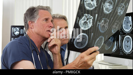 Team of competent doctors working in the office Stock Photo