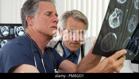 Two senior doctors working in the office Stock Photo