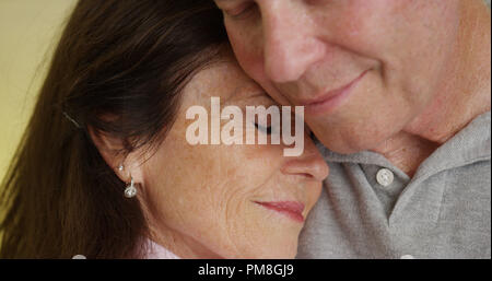 Loving older couple hugging each other Stock Photo