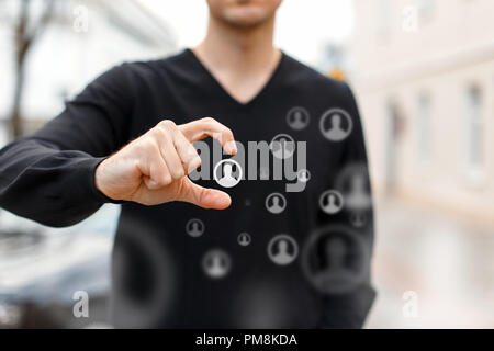 Human resources management and recruitment. Man chooses the right people. Flying icons Stock Photo