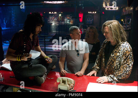 (L-r) RUSSELL BRAND, director ADAM SHANKMAN, JULIANNE HOUGH, and ALEC BALDWIN on set during the production of New Line Cinema's rock musical 'ROCK OF AGES,' a Warner Bros. Pictures release. Stock Photo