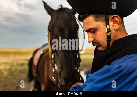 Portrait of a Hungarian wrangler with his horse Stock Photo