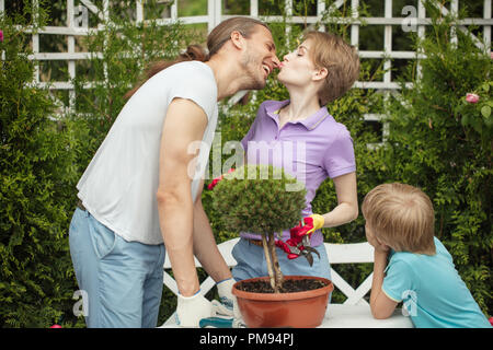 Mother and little boy shopping in gardening center Stock Photo
