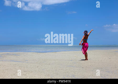 Girl on the beach of Ile aux Benitiers, Mauritius
