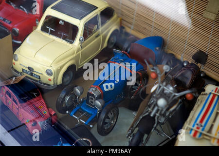 Calle del Amor de Dios; Sevilla, Andalusia, Spain: classic toy cars in a shop window Stock Photo