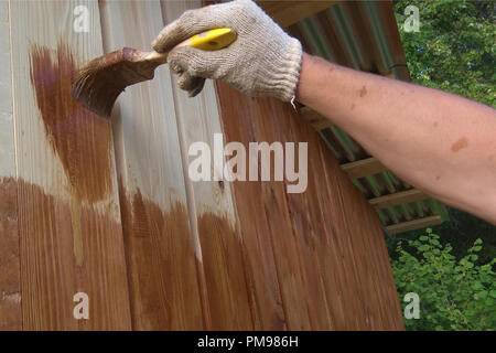 Hand-made brush for manual painting on a wooden wall 2018 Stock Photo