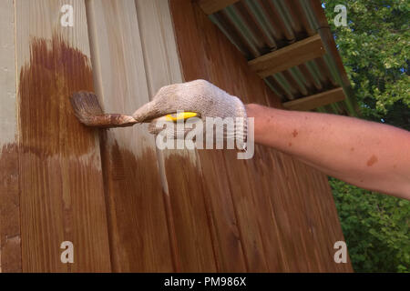 Hand-made brush for manual painting on a wooden wall 2018 Stock Photo