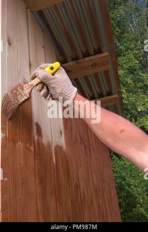 Hand-made brush for manual painting on a wooden wall 2018 Stock Photo
