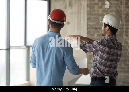 two workers are going to destroy building Stock Photo