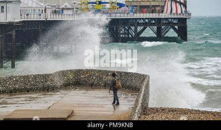 Brighton UK 18th September 2018 - Waves crash on to Brighton seafront as Storm Helene starts to hit Britain with winds of up to 70 mph expected in some parts of the UK over the next few days Credit: Simon Dack/Alamy Live News