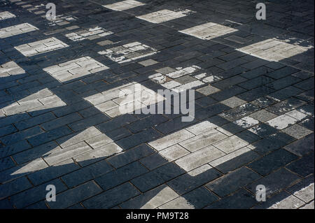 Surface rough of asphalt, Grey with white line on the road and small rock, Texture Background. Stock Photo