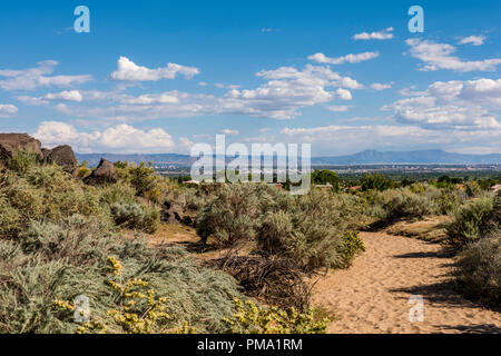 Albuquerque city view, landscape and Sandia Mountains from Piedras Marcadas Canyon trail in Petroglyph National Monument, New Mexico USA Stock Photo