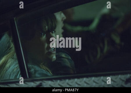 Liz (KIELE SANCHEZ) and husband Shane (ZACH GILFORD) try to survive the night in 'The Purge: Anarchy' Stock Photo