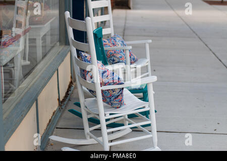 two chair on the side walk with pillows Stock Photo