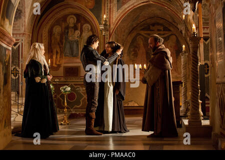 (Center, left) Stars Douglas Booth, Hailee Steinfeld, and Paul Giamatti (far right) in a scene from Relativity Media's 'ROMEO AND JULIET'. Stock Photo