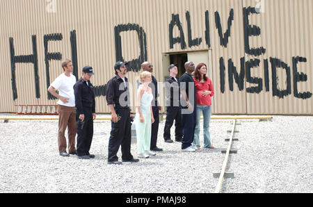 (L to R) Human survivors Michael (JAKE WEBER), Terry (KEVIN ZEGERS), CJ (MICHAEL KELLY), Ana (SARAH POLLEY), Kenneth (VING RHAMES), Bart (MICHAEL BARRY), Andre (MEKHI PHIFER) and Luda (INNA KOROBKINA) await the arrival of possible rescue in the zombie action thriller, Dawn of the Dead. (2004) Stock Photo