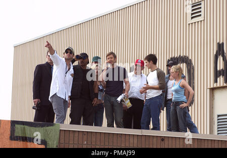 (Far left) Director of photography MATTHEW F. LEONETTI, (L to r) TY BURRELL as Steve, Director ZACK SNYDER, VING RHAMES as Kenneth, KIM POIRIER as Monica, BOYD BANKS as Tucker, JAKE WEBER as Michael, R.D. REID as Glen, KEVIN ZEGERS as Terry, MICHAEL KELLY as CJ and SARAH POLLEY as Ana on the set of the zombie action thriller, Dawn of the Dead. (2004) Stock Photo