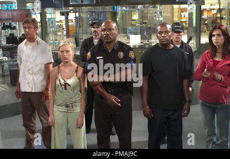 (L to R) Michael (JAKE WEBER), Ana (SARAH POLLEY), CJ (MICHAEL KELLY), Kenneth (VING RHAMES), Andre (MEKHI PHIFER), Terry (KEVIN ZEGERS) and Luda (INNA KOROBKINA) survey the aftermath of a mall breach in the zombie action thriller, Dawn of the Dead. (2004) Stock Photo