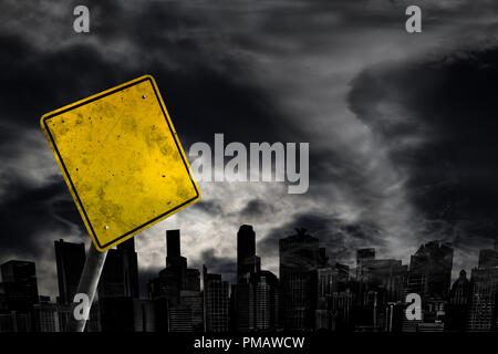 Empty weather warning sign against a powerful stormy background with city silhouette and copy space. Dirty and angled sign with cyclonic winds add to  Stock Photo