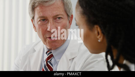 Two doctors sharing their professional opinions about patient's file Stock Photo
