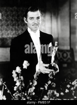 Clark Gable accepting his Best Actor Oscar for his performance in 'It Happened One Night' at the 7th Academy Awards, honoring the best in film for 1934, was held on February 27, 1935, at the Biltmore Hotel in Los Angeles, California File Reference # 33371 513THA Stock Photo