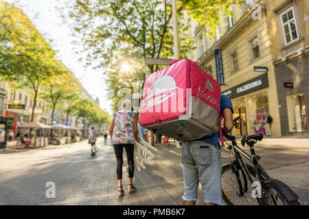 Vienna Austria September.17 2018, Foodora is a Berlin-based online food delivery company with international presence in 9 Countries, cyclist carrying  Stock Photo