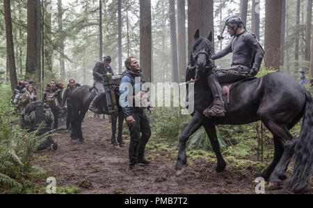 Caesar, portrayed by Andy Serkis (in performance capture suit), the leader of the ape nation, and Malcolm (Jason Clarke), a representative of a colony of human survivors, reach a fragile peace in DAWN OF THE PLANET OF THE APES. Stock Photo