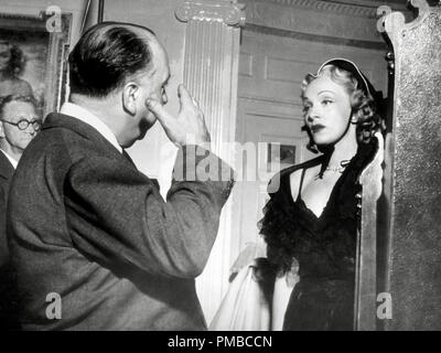 Marlene Dietrich with director Alfred Hitchcock on the set of 'Stage Fright' 1950 Warner Bros. File Reference # 32914 622THA Stock Photo