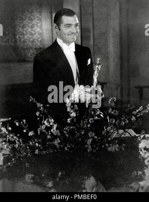 Clark Gable accepting his Best Actor Oscar for his performance in 'It Happened One Night' at the 7th Academy Awards, honoring the best in film for 1934, was held on February 27, 1935, at the Biltmore Hotel in Los Angeles, California File Reference # 33371 681THA Stock Photo