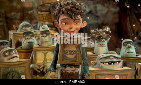 Eggs (center, voiced by Isaac Hempstead Wright) is surrounded by his Boxtroll friends in LAIKA and Focus Features' family event movie THE BOXTROLLS Stock Photo