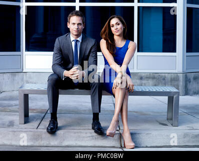 SUITS -- Season: 2 -- Pictured: (l-r) Patrick J. Adams as Mike Ross, Meghan Markle as Rachel Zane -- Photo by: Robert Ascroft/USA Network (2012) Stock Photo