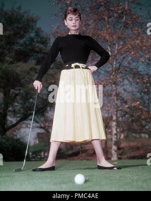 Audrey Hepburn playing golf, circa 1955 File Reference