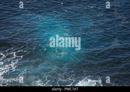 Sea water and seafoam, viewed from above and closeup. Stock Photo