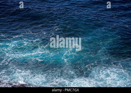 Seafoam and water, viewed from above and closeup. Abstract effect. Stock Photo