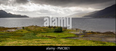 Mountains lead down to the shores of Loch Carron, an inlet of the Atlantic Ocean in the west Highlands of Scotland. Stock Photo