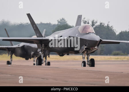 US Air Force Lockheed Martin F-35A Lightning II at the Royal International Air Tattoo, RIAT, RAF Fairford. Taxiing in pair Stock Photo