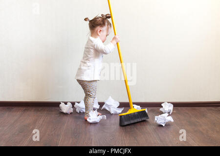 https://l450v.alamy.com/450v/pmcjfx/child-sweeps-broom-with-paper-bins-in-the-apartment-household-chores-pmcjfx.jpg