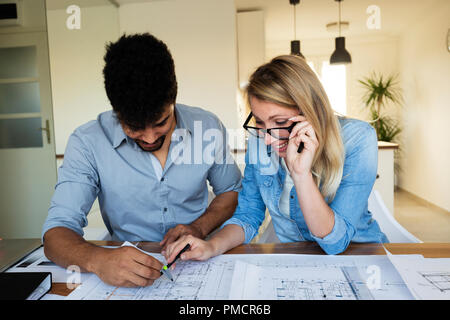 Architect colleagues working in office Stock Photo