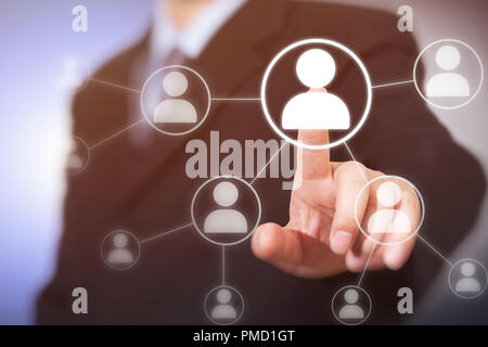 Businessman pressing modern social buttons on a virtual background Stock Photo